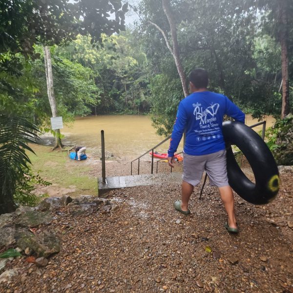 getting into the river to do cave tubing